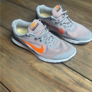 Nike woman’s ' Gray and Orange Sneakers
